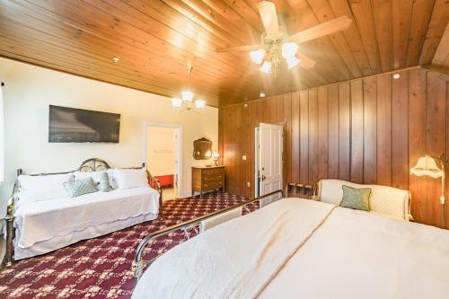 a bedroom with two beds and a ceiling fan at Desperado - CA King Size Bed - Sleeps 2-4 in Lynchburg
