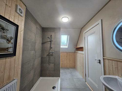 a bathroom with a shower and a sink at lakeview Guesthouse Virginia in Lisgrea
