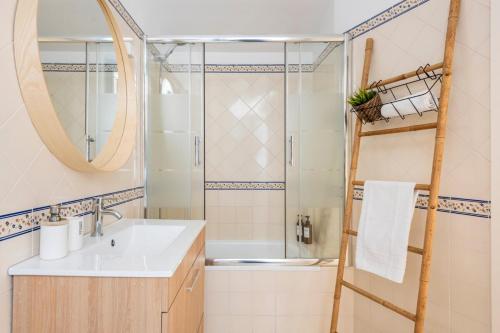 a bathroom with a sink and a shower at Baixa Heritage Apartments by Cathedral & Tram 28 by NestAtLisbon in Lisbon
