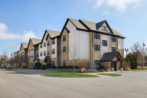 a large apartment building on a street at Residence Inn by Marriott Lincoln South in Lincoln