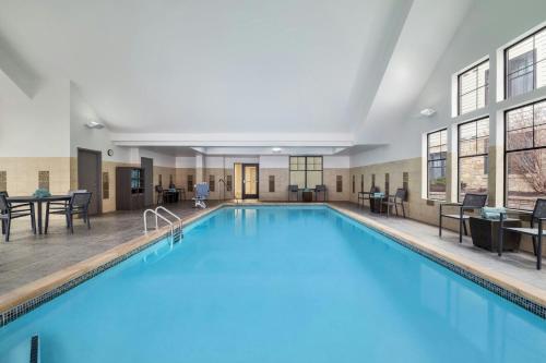 a large pool with blue water in a building at Residence Inn by Marriott Lincoln South in Lincoln