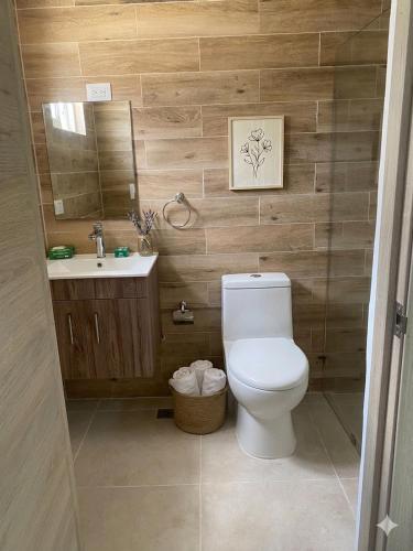 a bathroom with a toilet and a sink at Samana condo by the beach in Las Terrenas