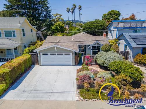 a house with a driveway in front of it at Mitchell's Cove Beach House in Santa Cruz