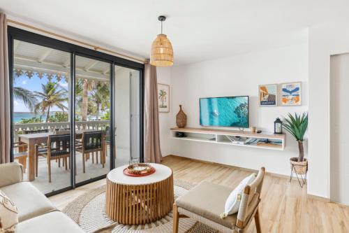 a living room with a view of the ocean at Alamanda 114 Oceanview 2BR Steps from Orient Bay in Orient Bay