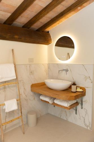 a bathroom with a sink and a mirror at Casa Gabri Boutique B&B Tuscan Villa retreat in Massa
