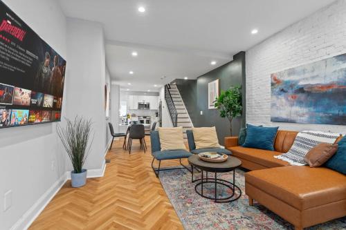 a living room with a couch and a table at Spacious 3BR Near Art Museum Patio Gameroom in Philadelphia