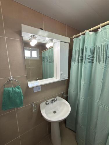 a bathroom with a sink and a mirror at Cabañas boutique la soñada BIS in Fiambalá
