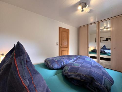 a bedroom with a bed with two pillows on it at Haus Anna in Stadlern