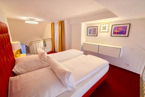 a hotel room with two beds with white sheets at Villa Viktoria 1 - Apartments - City center in Ingolstadt