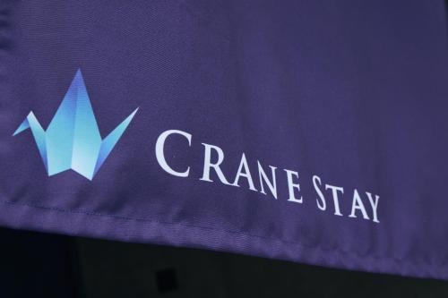 a purple sign with the words crane stay on it at Crane Stay Shibuya in Tokyo