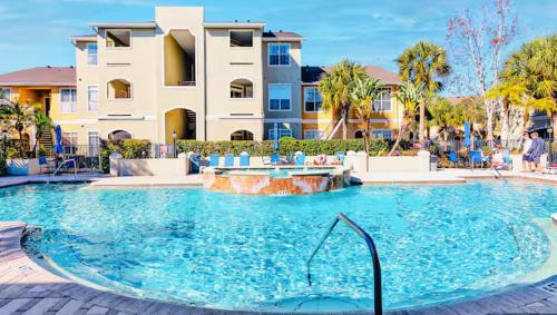 a large swimming pool in front of a building at Gorgeous condo, 2 bedrooms, 2 baths, with pool, minutes to Clearwater Beach in Clearwater