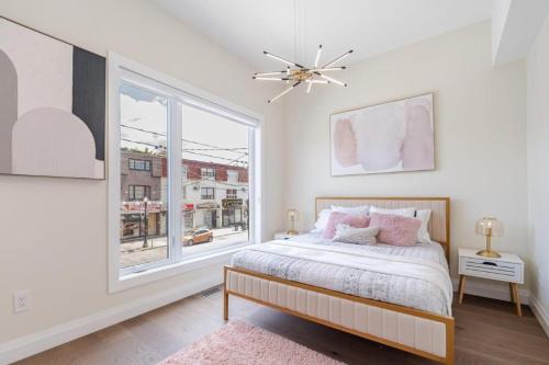 a bedroom with a bed and a window at Toronto Midtown Luxury Living in Toronto