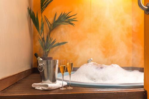 a table with two glasses of champagne and snow at RotoVegas Motel of Rotorua in Rotorua