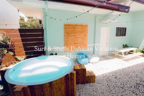 a room with a bathtub in a house at 2BR w/mini dipping tub + 2 mins to beach in Mati