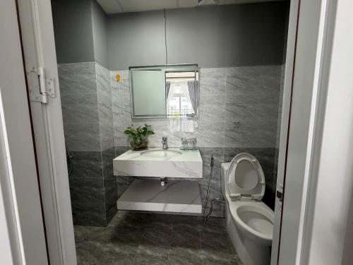 a bathroom with a sink and a toilet at Sun's house in Phan Rang–Tháp Chàm