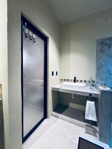 a bathroom with a shower and a tub and a sink at Bernardino in Valladolid