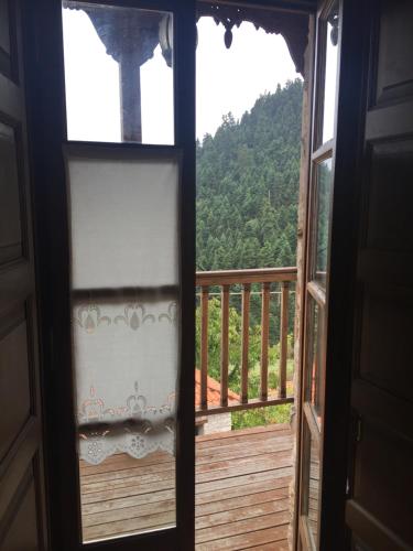a window view of a mountain from a house at Old Inn in Karpenision