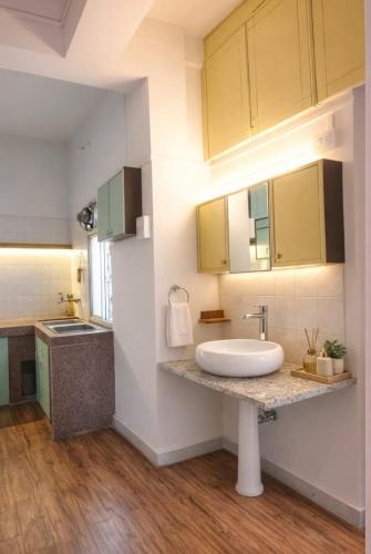 a bathroom with a sink and a counter top at Celestial crest in Pune
