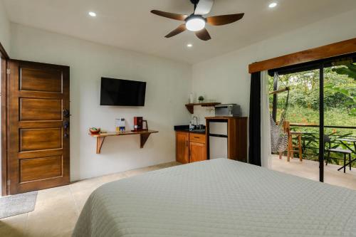 a bedroom with a bed and a ceiling fan at Creekside Lofts #1 in Fortuna