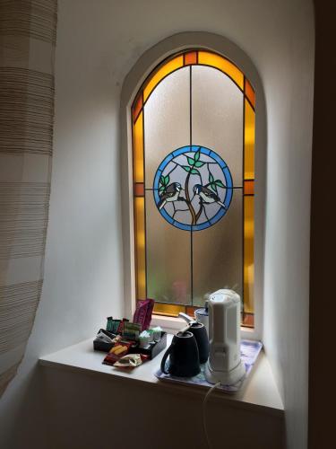 a window with a coffee maker in front of it at Arduthie House in Stonehaven