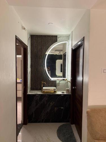 a bathroom with a sink and a mirror at sun vacation resort in Visakhapatnam