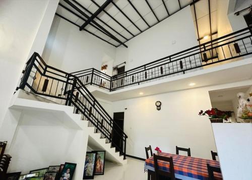 a room with a staircase with a bench in the middle at Ehana holiday in Tangalle