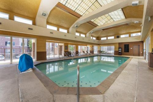 a large swimming pool with a large ceiling at Comfort Inn & Suites Orem - Provo in Orem