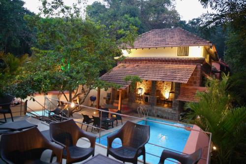 an image of a resort with a swimming pool at Lar Amorosa in Calangute