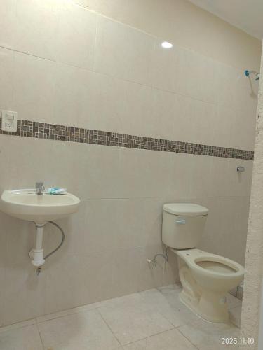a bathroom with a toilet and a sink at Apartamento Turiksa in Acapulco