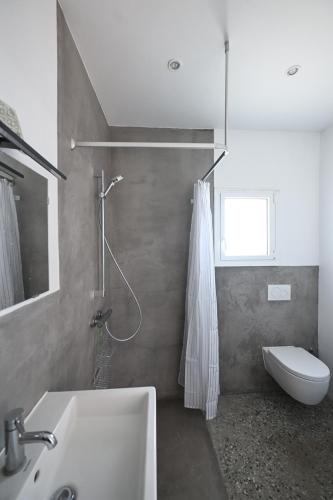 a bathroom with a sink and a toilet at Summer house Spiti Pirgos in Epanomi