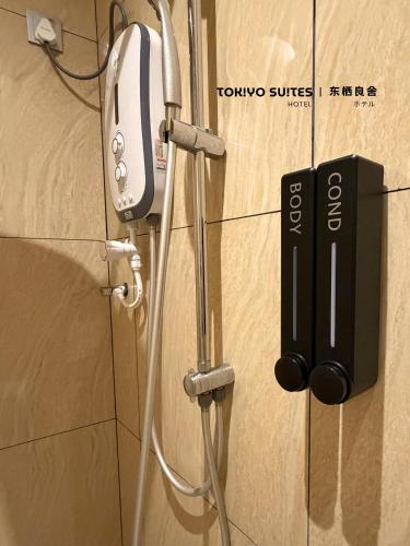 a phone hooked up to a wall in a room at Tokiyo Suites Hotel Kinta River Ipoh Town in Ipoh
