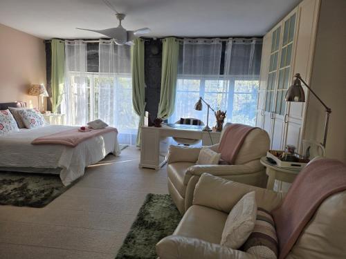 a bedroom with a bed and a living room at B&B Sallent in Sallent