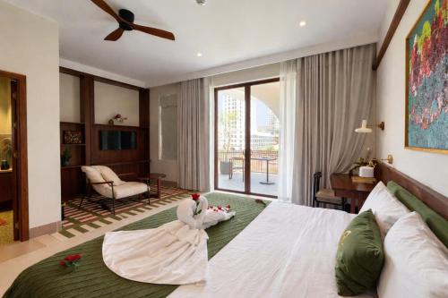 a bedroom with a bed with a stuffed animal on it at Magnolia Boutique Hue in Thôn Trường Giang