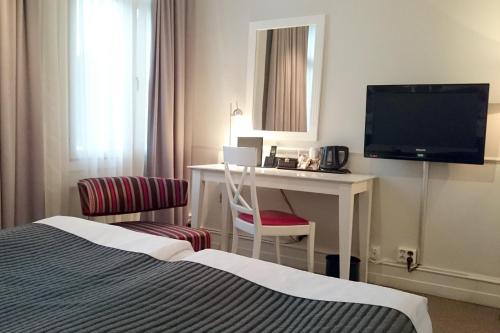 Postel nebo postele na pokoji v ubytování Elite Hotel Savoy