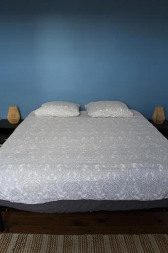 Llit o llits en una habitació de L'écoutille