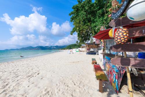 a stand on the beach with a view of the ocean at Best Beach Bungalows in Chaweng