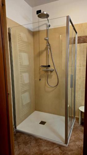a shower with a glass enclosure in a bathroom at Hotel Vittoria in Riva del Garda