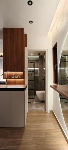 a kitchen with a sink and a bath tub at Celestial Luxury SKG Port in Thessaloniki