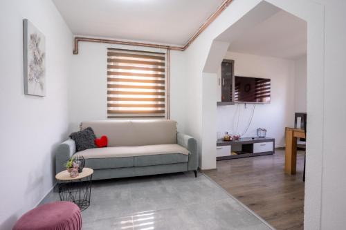 a living room with a couch and a table at Apartman Vanessa in Gospić