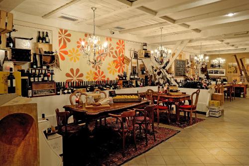 a room with tables and chairs in a store at Grand Hotel Paradiso in Passo del Tonale