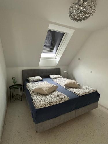 a bedroom with two beds in a attic at Augarten in Vienna