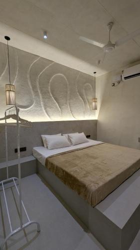 a bedroom with a large bed in a room at Prime Suites in Varkala
