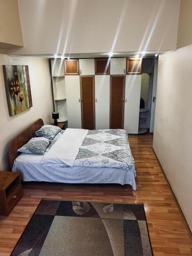 a bedroom with a large bed in a room at Михайловская in Kyiv