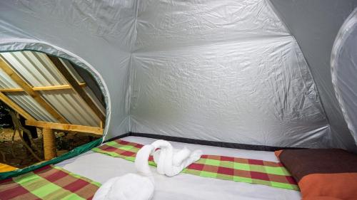 a room with two swans in a tent at Sigiri Jungle Camping in Sigiriya