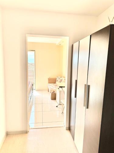 an open door to a room with a living room at Хотел Дани in Sandanski