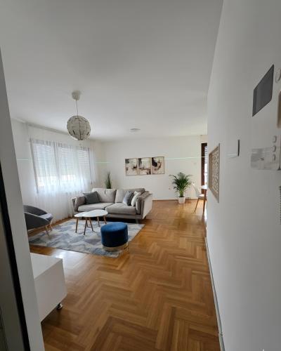 a living room with a couch and a table at Area 51 in Banja Luka