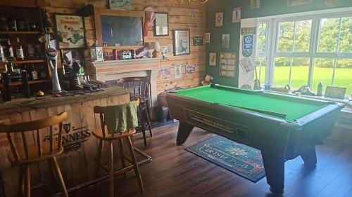 a billiard room with a pool table and a bar at lakeview Guesthouse Virginia