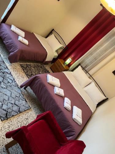 a bedroom with two beds with pillows on it at Studio Sevasti in Kala Nera