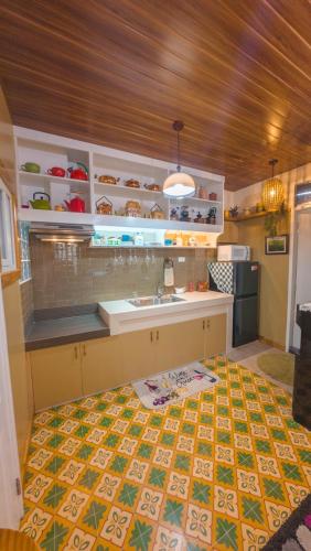 a kitchen with a sink and a counter top at 18 Camella in Baguio