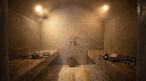a bathroom with two sinks and a shower at AG Hotel & Spa Marrakech in Marrakesh